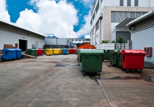 Exterior view of commercial waste containers at a Barking business site