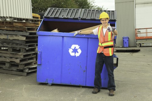 Investigator examining records and photos during a commercial waste complaint review